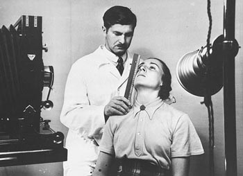 The facial features of a young German woman are measured during a racial examination. [Photograph #78569]